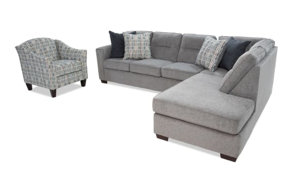 Dylan Slate 112" 2-piece right arm facing chaise sectional in gray polyester fabric with memory foam cushions, four patterned and solid accent pillows, and a matching transitional-style accent chair with a blue-gray geometric pattern.
