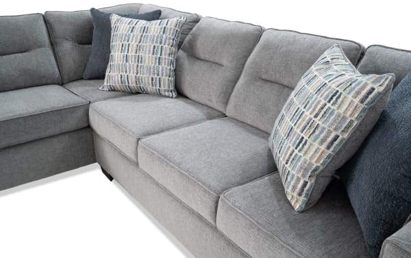 Dylan Slate 112'' 2 Piece Left Arm Facing Chaise Sectional in gray polyester fabric with memory foam cushions, transitional style, and four patterned accent pillows.