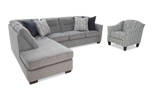 Dylan Slate 112'' 2-piece left arm facing chaise sectional with matching accent chair in gray polyester fabric. Transitional style with memory foam cushions and four patterned accent pillows.