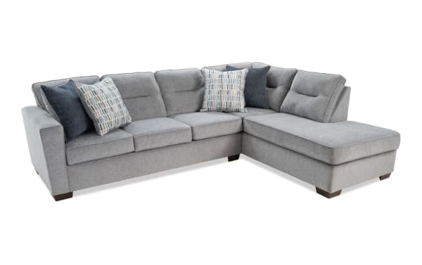 Dylan Slate 112" 2-piece right arm facing sleeper chaise sectional in gray polyester fabric, transitional style with four accent pillows and queen gel memory foam mattress.
