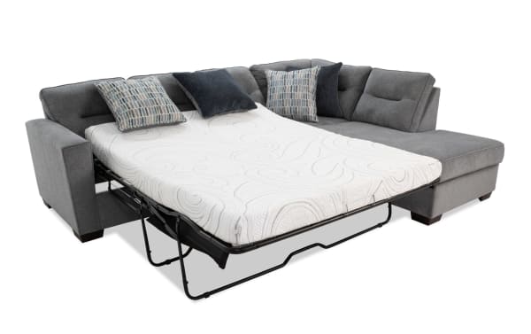 Dylan Slate 112" right arm facing sleeper chaise sectional in gray polyester fabric with transitional style, memory foam queen cooling mattress, and four accent pillows.
