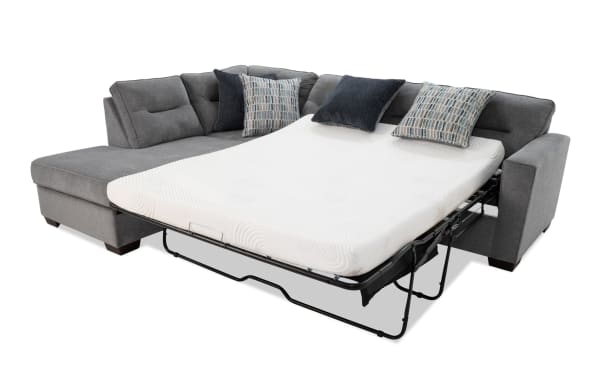 Dylan Slate 112" 2-piece left arm facing transitional sleeper chaise sectional in gray polyester fabric with queen gel memory foam mattress and four accent pillows.