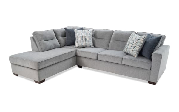 Dylan Slate 112" 2-piece left arm facing sleeper chaise sectional in gray polyester fabric with transitional style, gel memory foam queen mattress, and four accent pillows.