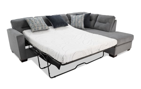 Dylan Slate 112" right arm facing transitional sleeper sectional in gray polyester fabric with queen cooling gel memory foam mattress, four accent pillows, and chaise.