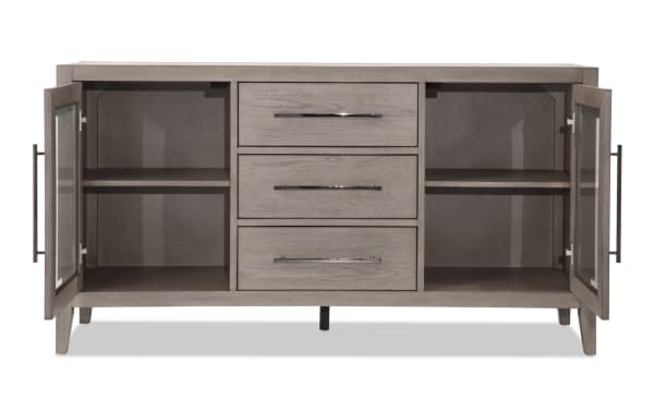 Villa 60" gray transitional TV stand with MDF and glass construction, featuring three central drawers, two glass-door cabinets with shelves, and cord management. Fully assembled for TVs up to 60 inches.