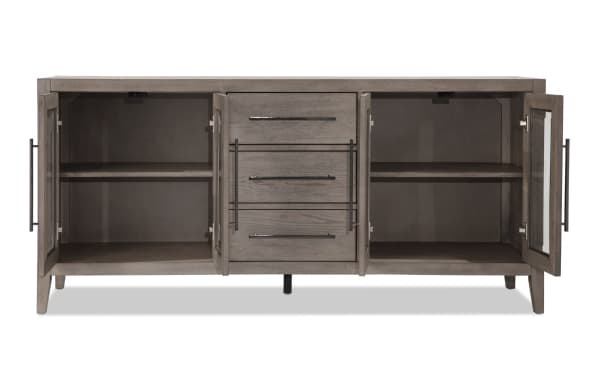 Villa 70" Gray Transitional TV Stand with MDF and glass construction, featuring three central drawers, two glass-door cabinets, and cord management for TVs up to 70 inches.