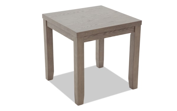Square wooden side table with light gray finish, visible wood grain texture, and four sturdy legs, suitable for living room or office use.