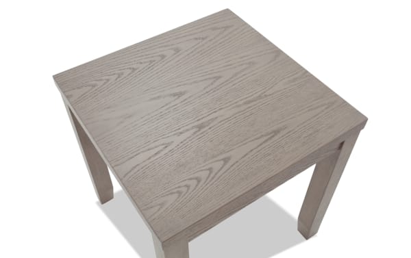 Square wooden side table with light gray finish and visible wood grain texture, featuring four straight legs and a smooth flat top surface.