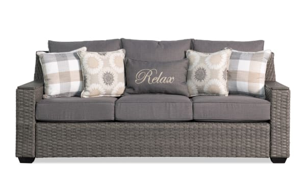 Cottage Chic Gray Wicker Outdoor Sofa with weather-resistant gray polyester cushions, powder-coated metal frame, and transitional wicker design.