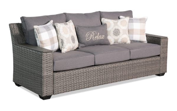 Cottage Chic Gray Wicker Outdoor Sofa with powder-coated metal frame, gray polyester cushions, transitional style, and weather-resistant wicker design.