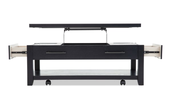 Modern black wooden coffee table with lift-top storage compartment and two pull-out side drawers, featuring metal handles and caster wheels for mobility.