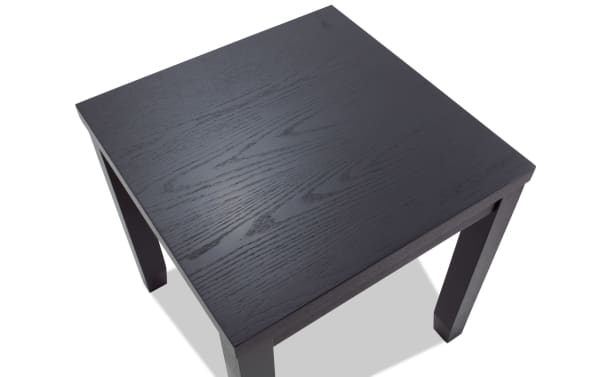Square black wooden side table with visible wood grain texture and four straight legs, suitable for living room or office use.