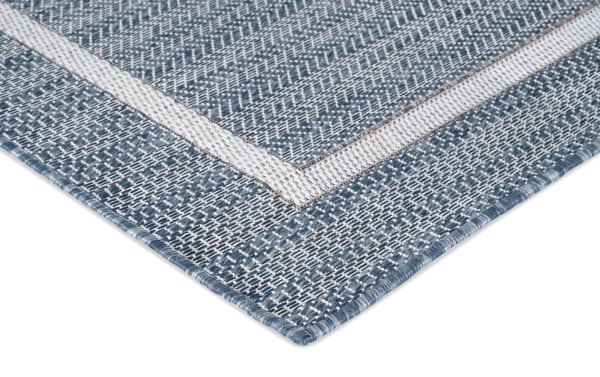 Contemporary Tides 5' x 7' blue geometric indoor/outdoor rug with flat pile, machine-woven polypropylene and textured pattern.