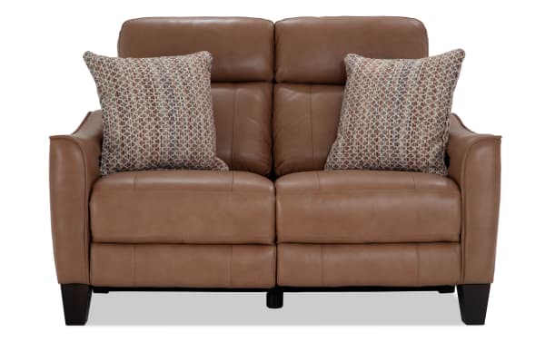 Empire Cognac leather 59'' power reclining loveseat with power headrest, transitional style, brown leather upholstery, includes patterned accent pillows.