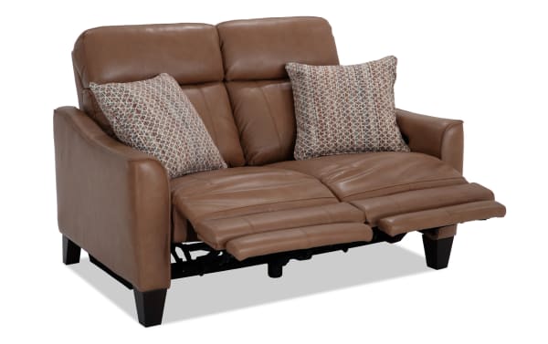 Empire Cognac Leather 59'' Power Reclining Loveseat with power headrest, brown leather upholstery, transitional style, includes patterned accent pillows.