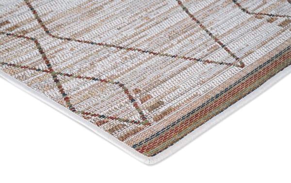 Beige Capri 5' x 7' Ikat indoor/outdoor rug with contemporary geometric pattern, flat pile polypropylene fibers for durability and easy outdoor use.