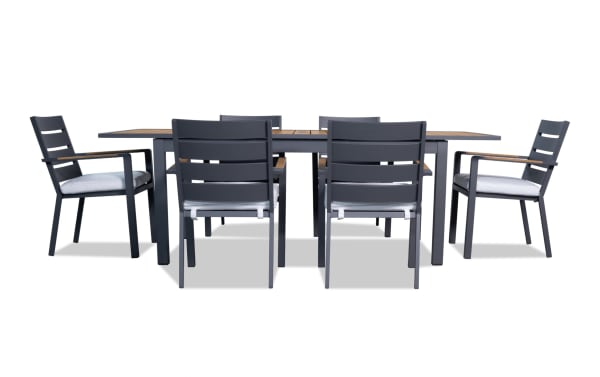 Laguna 7 Piece Gray Aluminum Outdoor Dining Set with powder-coated metal frame, polyester fabric cushions, and extendable leaf for contemporary patio dining.