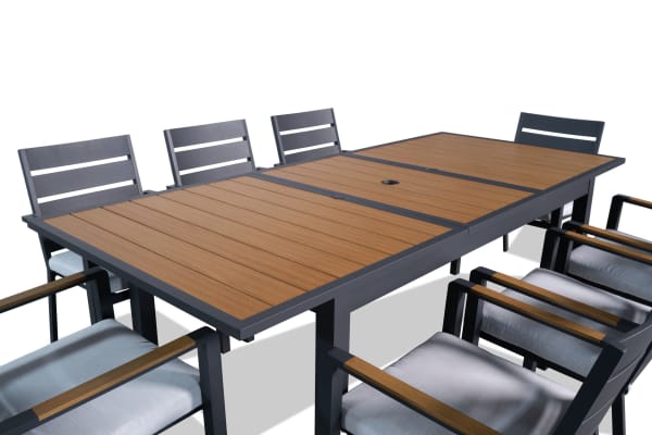 Laguna 9 Piece Gray Aluminum Outdoor Dining Set with extendable wood-look table, gray powder-coated frame, and cushioned polyester seats.