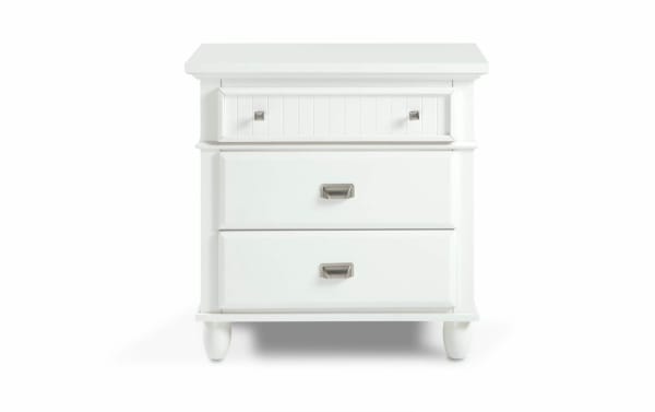 White Spencer transitional nightstand from Spencer 4 Piece King White Panel Bedroom Set, made of hardwood solids, MDF, plywood, and poplar with metal handles.