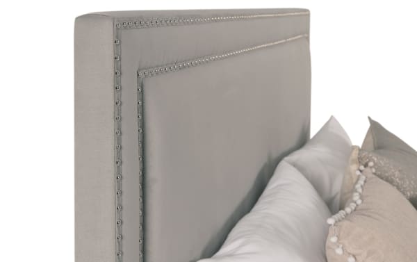 Gray Tremont King Upholstered Panel Bed with polyester fabric, nailhead trim, and rubberwood solids in a transitional style.
