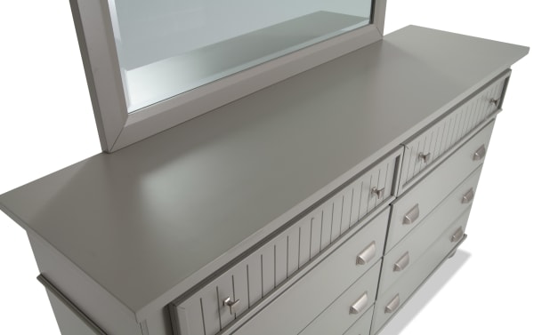 Spencer Gray 8 Drawer Dresser & Mirror in transitional style, featuring hardwood solids, MDF, plywood, and poplar construction with a smooth gray finish and vertical groove drawer fronts.