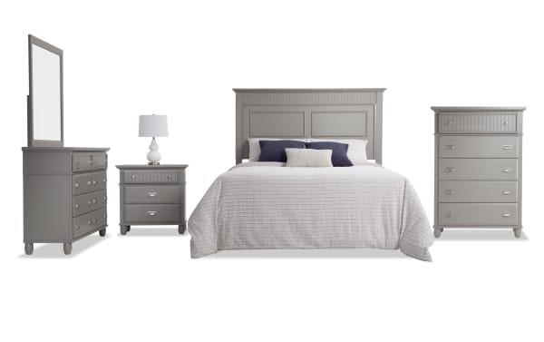 Spencer 5 Piece Full Gray Panel Bedroom Set with hardwood solids, MDF, and veneers. Includes gray transitional headboard, dresser with mirror, chest, and nightstand with multiple storage drawers.