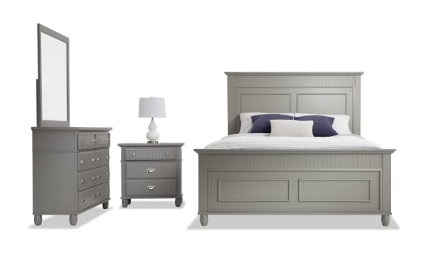 Spencer 4 Piece Queen Gray Panel Bedroom Set in transitional style, featuring hardwood solids, MDF, plywood, poplar, and veneers. Includes a queen bed with paneled headboard and footboard, a dresser with mirror, and a nightstand, all in gray finish with multiple storage drawers for organization.