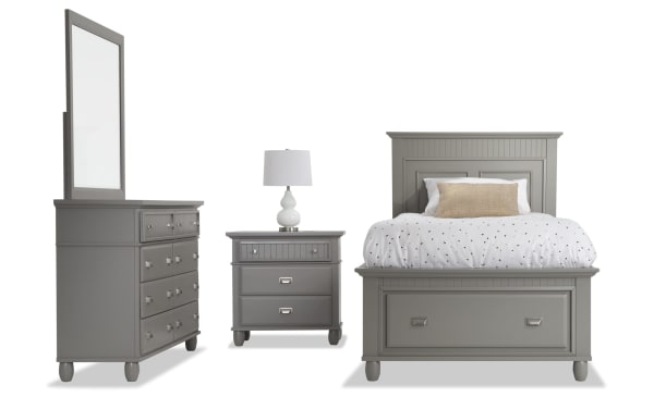 Spencer 4 Piece Twin Gray Storage Platform Bedroom Set in transitional style with hardwood solids, MDF, and poplar. Includes bed with under-bed storage drawer, dresser with mirror, and nightstand, all in gray finish with paneled detailing and metal drawer pulls.