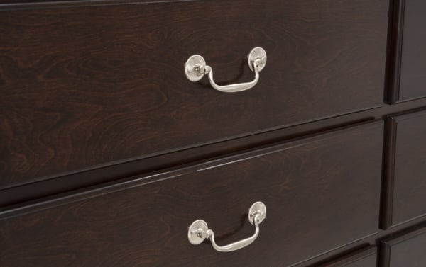 Dark cherry wood dresser drawer fronts with a smooth transitional style, featuring silver metal handles, part of the Middleton Bedroom collection.