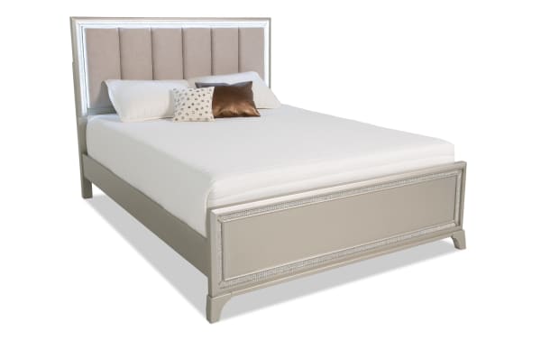 Celine Queen Silver Upholstered Panel Bed with glam silver lacquer wood frame, lighted fabric polyester headboard, and crystal trim.