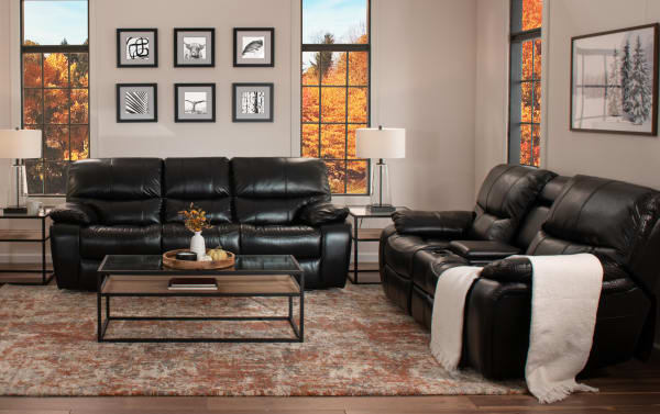 Avenger Black 89'' Power Reclining Sofa with USB Port in faux leather upholstery, transitional style, memory foam cushions, and cup holders.