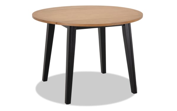 Blake Black & Natural Round Drop Leaf Dining Table with black tapered legs, natural wood top, cottage style, made of birch, mango veneers, and hardwood solids.