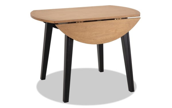 Blake Black & Natural Round Drop Leaf Dining Table with black tapered legs, natural wood top, cottage style, made of birch, mango veneers, and hardwood solids, ideal for small spaces.