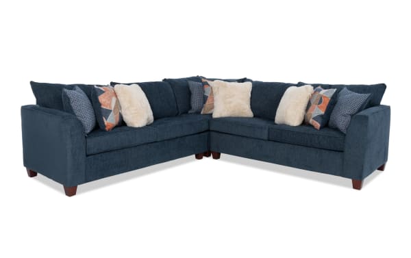 Brynn Navy 114'' 3 Piece Sectional in soft navy polyester fabric with Bob-O-Pedic memory foam cushions, transitional style, and mixed patterned accent pillows.