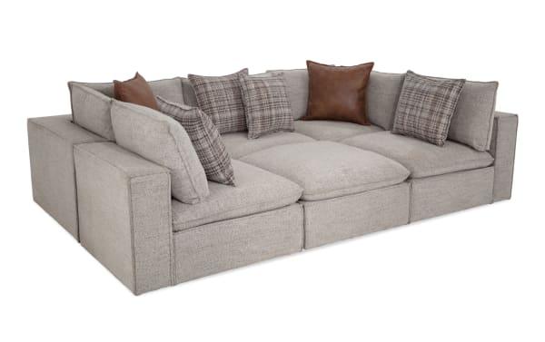 Infinity Gray 117'' 6-piece modular sectional sofa in gray polyester fabric with Bob-O-Pedic® seats, feather-blend pillows, and Siberian pine frame.