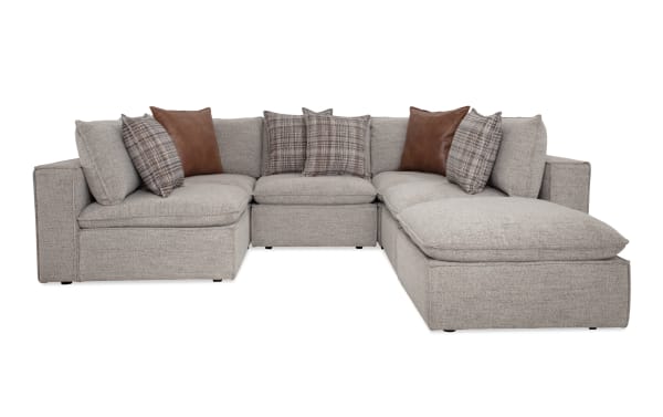 Infinity Gray 117'' 6-piece modular sectional in gray polyester fabric with 3 armless chairs, 2 corners, 1 ottoman. Transitional style with Bob-O-Pedic® seats, feather blend pillows, removable cushions, and sturdy Siberian pine frame.