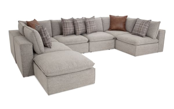 Transitional Infinity Gray 7-piece modular sectional with 4 armless chairs, 2 corners, 1 ottoman in gray polyester fabric, Bob-O-Pedic® seats, feather-blend pillows, and Siberian pine frame.