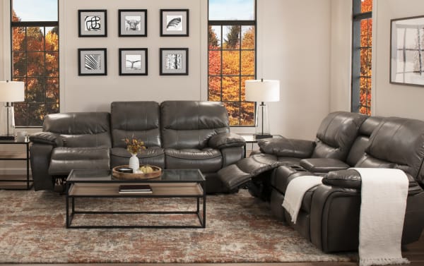 Avenger Gray 78'' Power Reclining Console Loveseat in transitional style with gray faux leather upholstery, memory foam cushions, USB port, cup holders, and hidden storage.