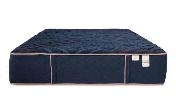 Copper Radiance 13'' King Extra Firm Mattress in dark blue with quilted copper-infused cover, gel layers, and wrapped coils for firm support.
