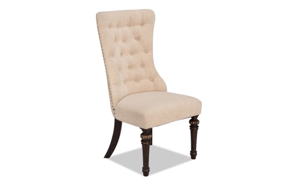 Regency Beige Solid Back Dining Chair with tufted beige polyester fabric, nailhead trim, Bob-O-Pedic memory foam seat, and dark wood legs.