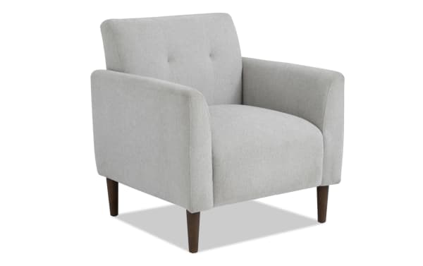 Maxwell Gray Accent Chair in transitional style with gray polyester fabric upholstery, button tufting, track arms, and tapered wooden legs.