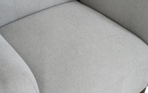 Maxwell Gray Accent Chair in gray polyester fabric with button tufting and flair track arms, featuring transitional style and memory foam cushioning.