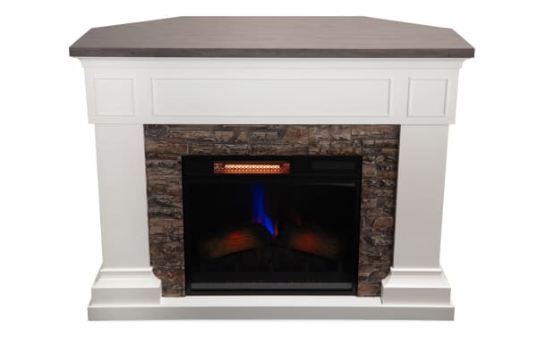 Stonebrook 23.5'' transitional electric fireplace with white MDF frame, brown wood top, and realistic faux flames set in stone surround.