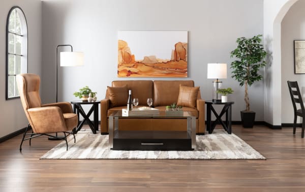 Transitional Bob-O-Pedic® Cognac Leather 73'' Queen Pop-Up Sleeper Sofa with slope arms, leather upholstery, accent pillows, and memory foam cushions in a modern living room setting.