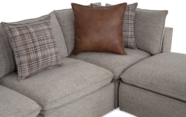 Gray Infinity 150" 6-piece modular sectional with polyester fabric, transitional style, includes 2 armless chairs, 2 corners, 2 ottomans, and mixed fabric and leather accent pillows.