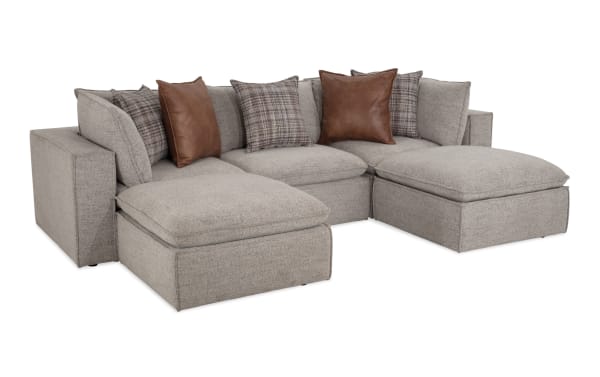 Infinity Gray 119" 5-piece transitional modular sectional with gray polyester fabric, 2 corners, 2 ottomans, armless chair, and feather-blend pillows.