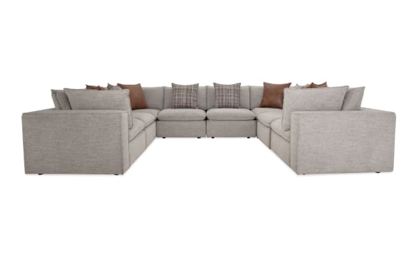 Infinity Gray 151'' 8-piece modular sectional with 4 armless chairs and 4 corners in gray polyester fabric. Transitional style with Bob-O-Pedic® seats and feather blend pillows.