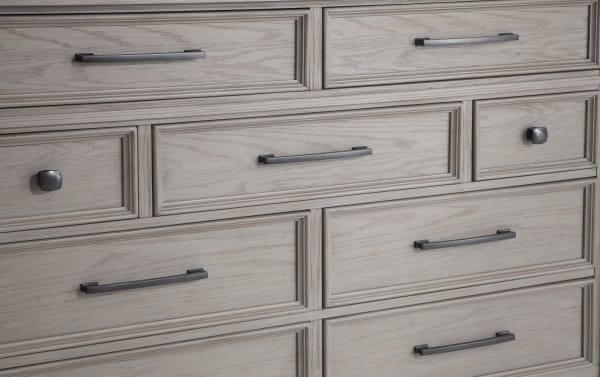 Hudson Gray 9-drawer dresser in distressed gray finish with pewter metal hardware, rubberwood and mango veneer, transitional rustic style.
