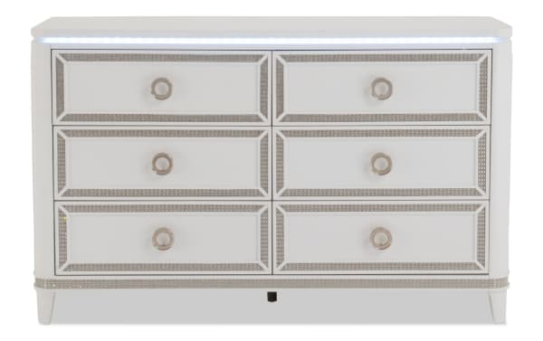 Glitz White 6 Drawer Dresser with glam poplar solids, chrome hardware, mirrored crystal trim, and built-in LED lights from Glitz Bedroom Collection.