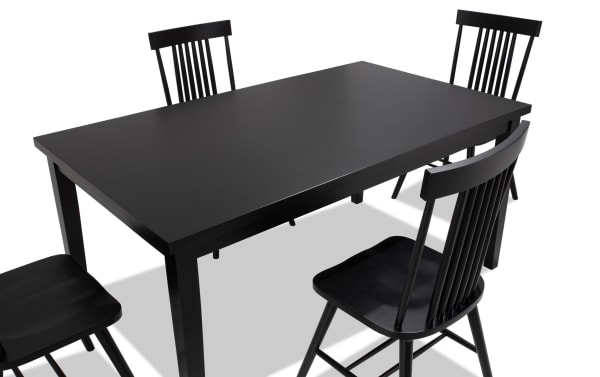 Dallas 5 Piece Black Dining Set with MDF table and four sleek Windsor chairs in transitional style, featuring a minimalistic rectangular silhouette.